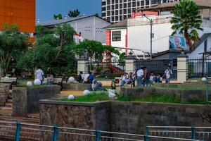 serpong south tangerang, march 4, 2024 - students gathered in the park beside the river. photo