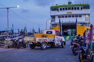Jepara Central Java, April 7, 2024 - rear view of an inter-island crossing ship against the background of the evening sky with free space for photocopying. front view of the ship docked at the Jepara photo