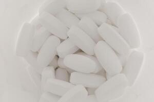 Magnesium tablets are white in a jar photo