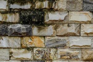 Close up view of old stone textured building dingding. photo