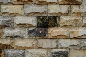 Close up view of old stone textured building dingding. photo