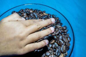 Close-up view of black coffee beans after roasting. photo