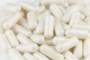 Magnesium mineral in white capsules photo