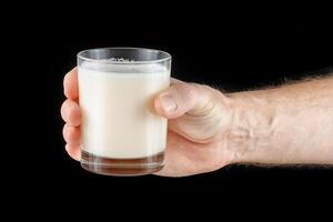 Protein in a glass in hand. photo