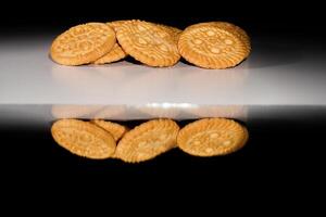 close up view of baked biscuits on black background. photo