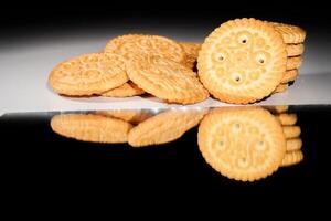 close up view of baked biscuits on black background. photo