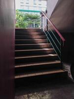 stairs leading upwards with sunlight effect, seen close to the point of view from below. photo