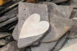 white heart on slate stones photo