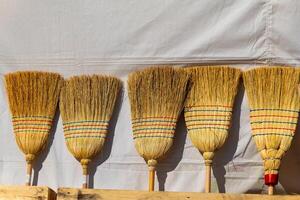 bunch of brooms with red and blue stripes photo