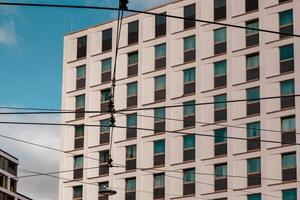 power lines in front of a modern building photo