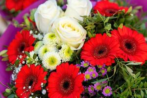 bouquet of red gerberas and white roses in spring photo