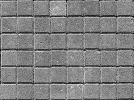 The texture of a stone monotonous pavement. Top view. Abstract background. photo