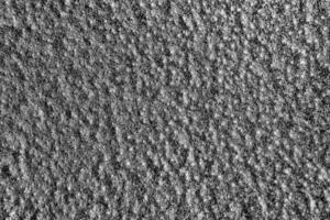 Monochrome texture of shiny grained metal. Abstract background. photo