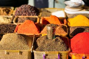 Multi-colored oriental spices on the counter of the bazaar. photo