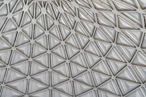 The steel inner part of the roof with the framework of the Chorsu Bazaar in Tashkent. Geometric architectural background. photo