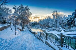 Sunset or dawn on a canal with non-freezing water on a cold winter day. photo