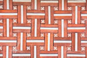 Texture of a decorative brick-like tiles. Abstract background for design. photo