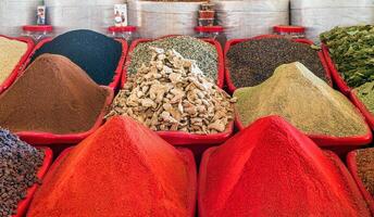 Multi-colored oriental spices on the counter of the bazaar. photo