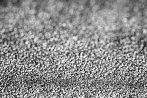 Monochrome texture of shiny grained metal. Abstract background. photo