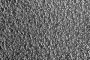 Monochrome texture of shiny grained metal. Abstract background. photo