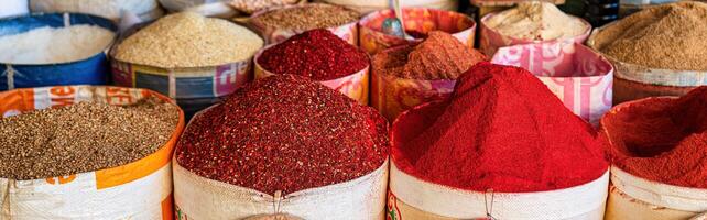 Multi-colored oriental spices on the counter of the bazaar. photo