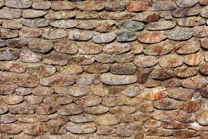Old antique stone wall texture. Abstract background for design. photo