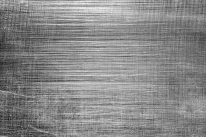 Monochrome texture of shiny scratched metal. Abstract background. photo