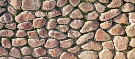 Texture of an old antique stone wall. Abstract background. photo