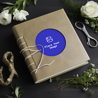 a leather bound photo album with flowers and scissors psd