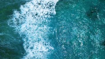 Intense dark waves with white foam, aerial view of breaking surf, barrier reef video