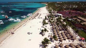 Aerial view of tropical beach, luxury resort with white sand on bright sunny day video