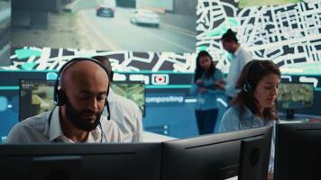 Woman call center operator transmitting directions through traffic after monitoring surveillance radar system at stop lights. Employee working on order tracking and express delivery. Camera B. video