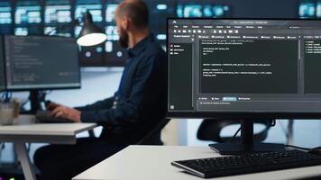 Computer scientist programming in high tech facility with server rows providing computing resources for different workloads. IT programmer overseeing supercomputers tasked with solving data operations video