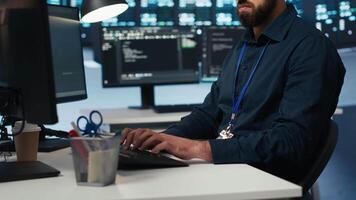 Proficient technician overseeing server room, running code on computer, troubleshooting servers. Software developer upgrading hardware clusters, networking systems and storage arrays video