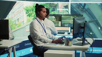 Indian call center operator gathers location and gps coordinates, monitoring traffic via surveillance camera system. Employee using CCTV real time footage to collect data. Camera A. video