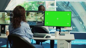 Agency operator monitoring traffic through radar surveillance with a mockup layout, using greenscreen next to CCTV footage. Employee gathering data on cars, satellite sensors. Camera A. video