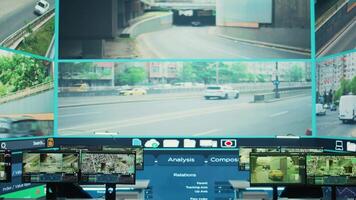 Empty monitoring room using a big screen to observe traffic through surveillance footage, government satellite CCTV system. National agency headquarters ensuring public safety on the streets. video