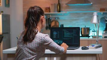 Woman remote thief stealing data from company hacking system from home. Programmer writing a dangerous malware for cyber attacks using performance laptop during midnight. video