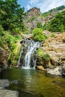 Beautiful view of Ravana Falls a popular sightseeing attraction in Ella a mountain town in the central highland of Sri Lanka. photo