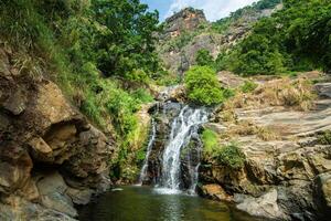 Beautiful view of Ravana Falls a popular sightseeing attraction in Ella a mountain town in the central highland of Sri Lanka. photo