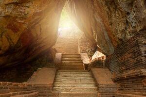 The narrow pathway to Sigiriya the UNESCO ancient fortress in Sri Lanka. The palace and fortress complex is recognized as one of the finest examples of ancient urban planning. photo