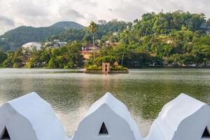 The small artificial island situated in the centre of Kandy lake, Sri Lanka. This island was used by the king's harem for bathing and was connected to the palace by secret tunnel. photo