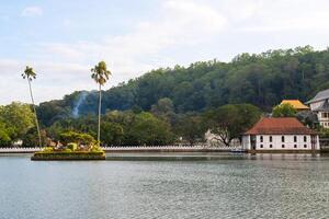 The small artificial island situated in the centre of Kandy lake, Sri Lanka. This island was used by the king's harem for bathing and was connected to the palace by secret tunnel. photo