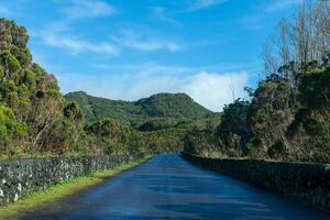 Scenic road leading to Algar do Carvao cave in Terceira Island, Azores. Spectacular natural beauty awaits around every bend. photo