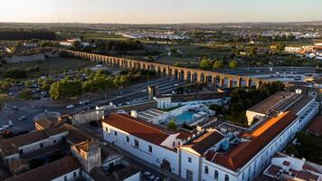 Aerial view of the 5-star Mar dAr Aqueduto Hotel in Evora, Portugal. The image shows the hotel stylish design and its proximity to the Agua de Pratato the Agua de Prata Aqueduct. photo