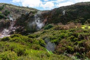 Surreal landscape of sulfur fumaroles at Terceira Island, Azores. Captivating natural wonders amid volcanic terrain. photo