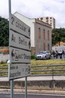 Signpost directing to Lisbon's Second Circular and Oriente Train Station, showcasing urban navigation in the heart of the city photo