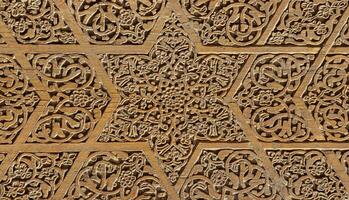 Fragment of an ancient carved wooden door. Ornate. photo