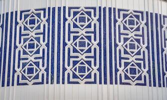 Geometric traditional Islamic ornament. Fragment of a ceramic mosaic. photo