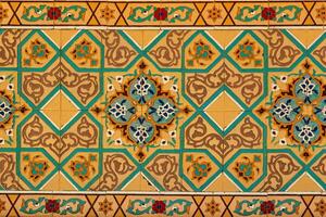 Geometric traditional Islamic ornament on a tile. Fragment of a ceramic mosaic. photo